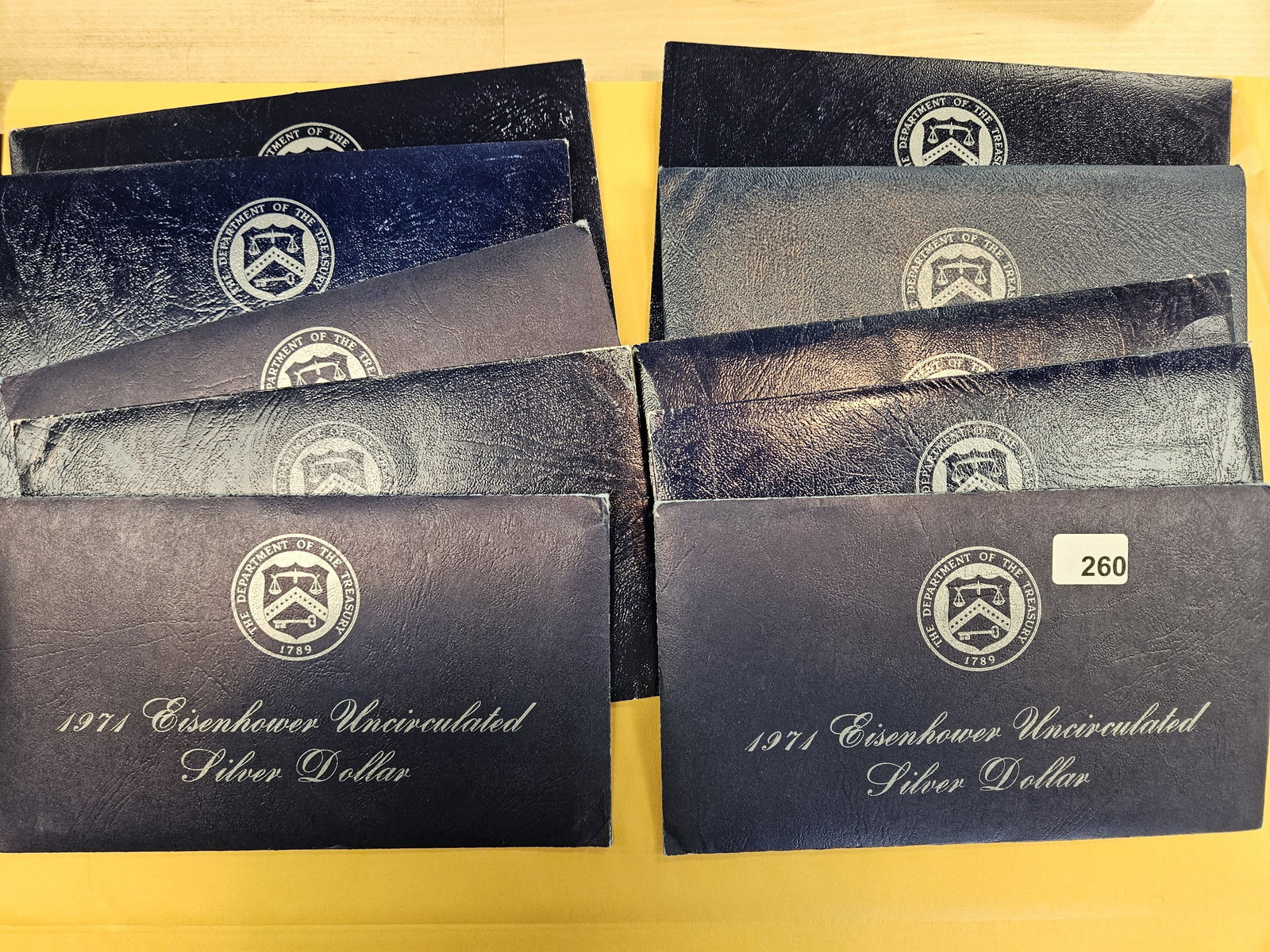 Ten GEM Brilliant Uncirculated SILVER Blue Ikes: Silver Eisenhower Dollars in Blue envelopes. In original blister packs