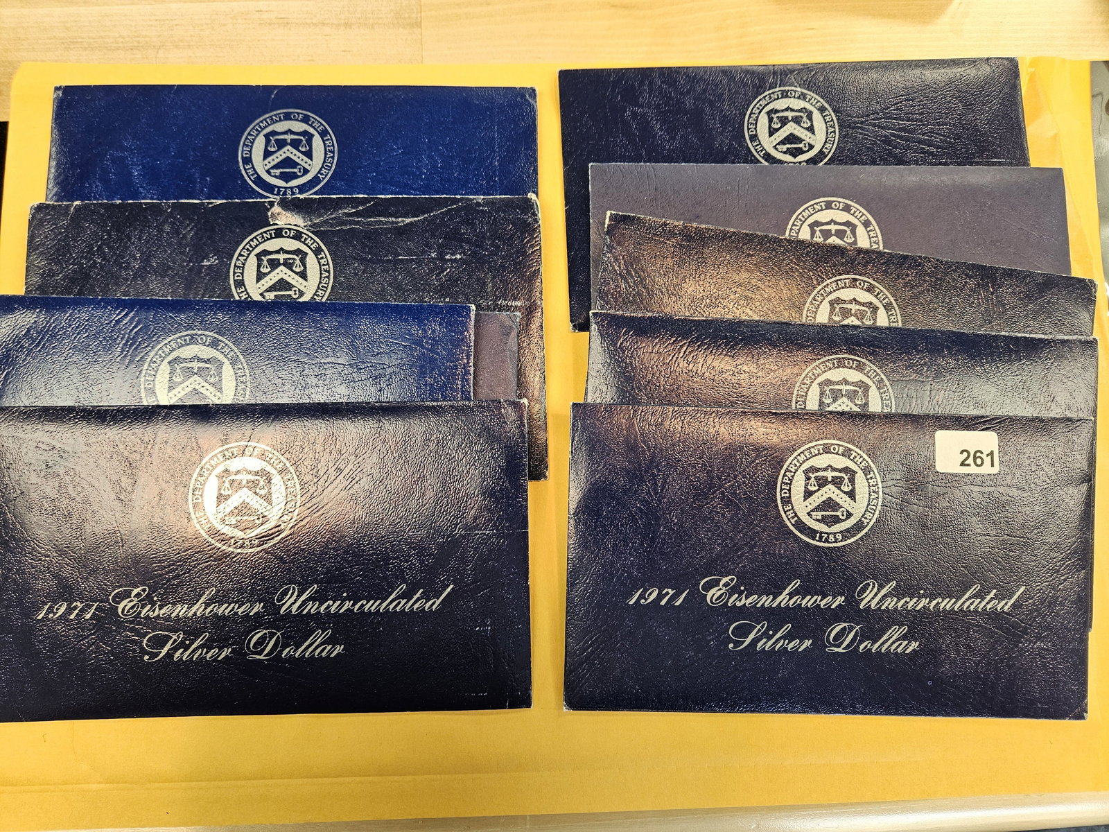 Ten GEM Brilliant Uncirculated SILVER Blue Ikes: Silver Eisenhower Dollars in Blue envelopes. In original blister packs