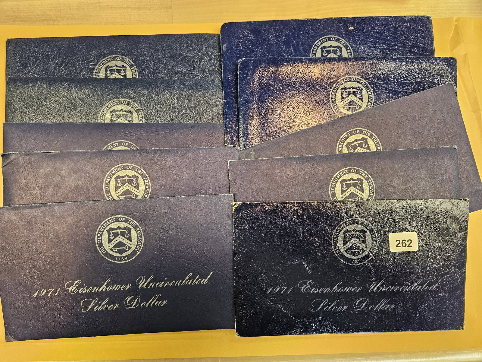 Ten GEM Brilliant Uncirculated SILVER Blue Ikes: Silver Eisenhower Dollars in Blue envelopes. In original blister packs