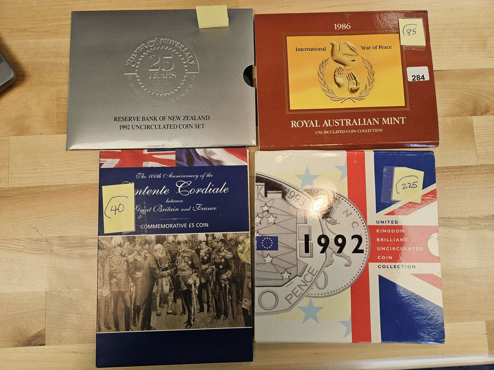 Seven fun, mixed, World coin sets: All in original holders 