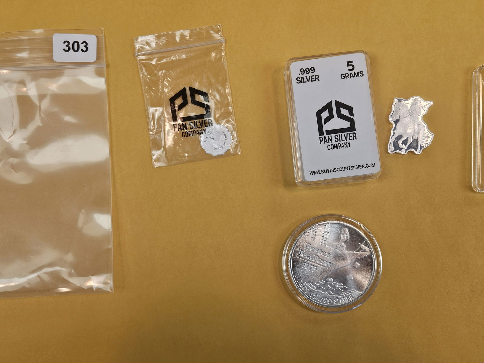 Three bits of .999 fine silver: A 1-troy ounce art round and two fractional art pieces. All .999 fine silver 