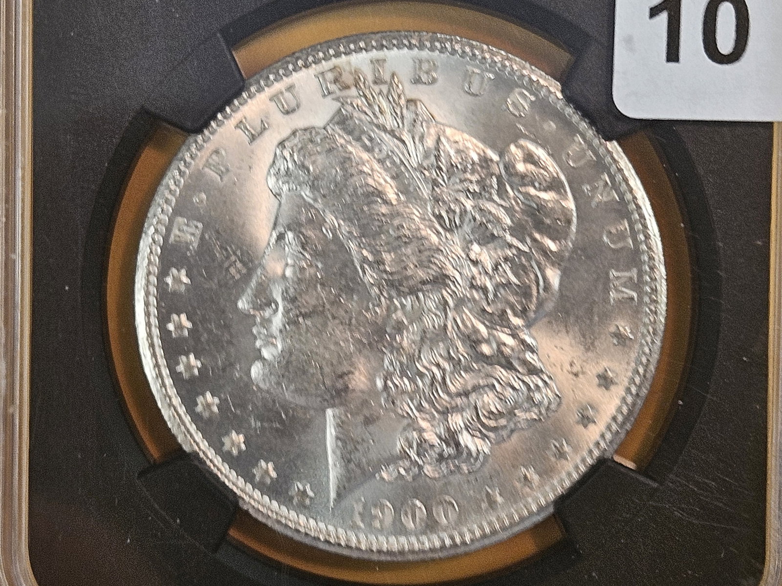 NGC 1900-O Morgan dollar in Brilliant Uncirculated: Original bag fragment. I guess it was just too hard to give it an actual numerical grade??? 