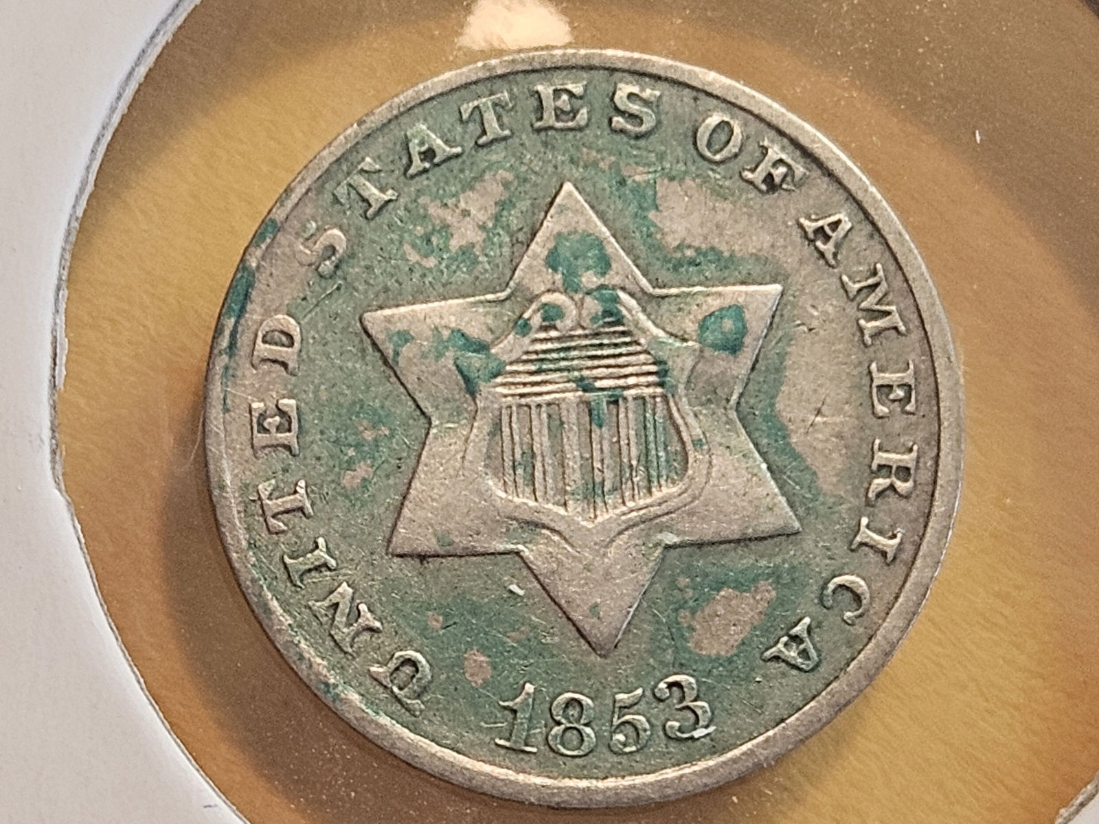 1853 Three Cent Silver Trime in Extra Fine plus: Has a splash of color on the obverse….not sure what the color is, but it's nice and green! 