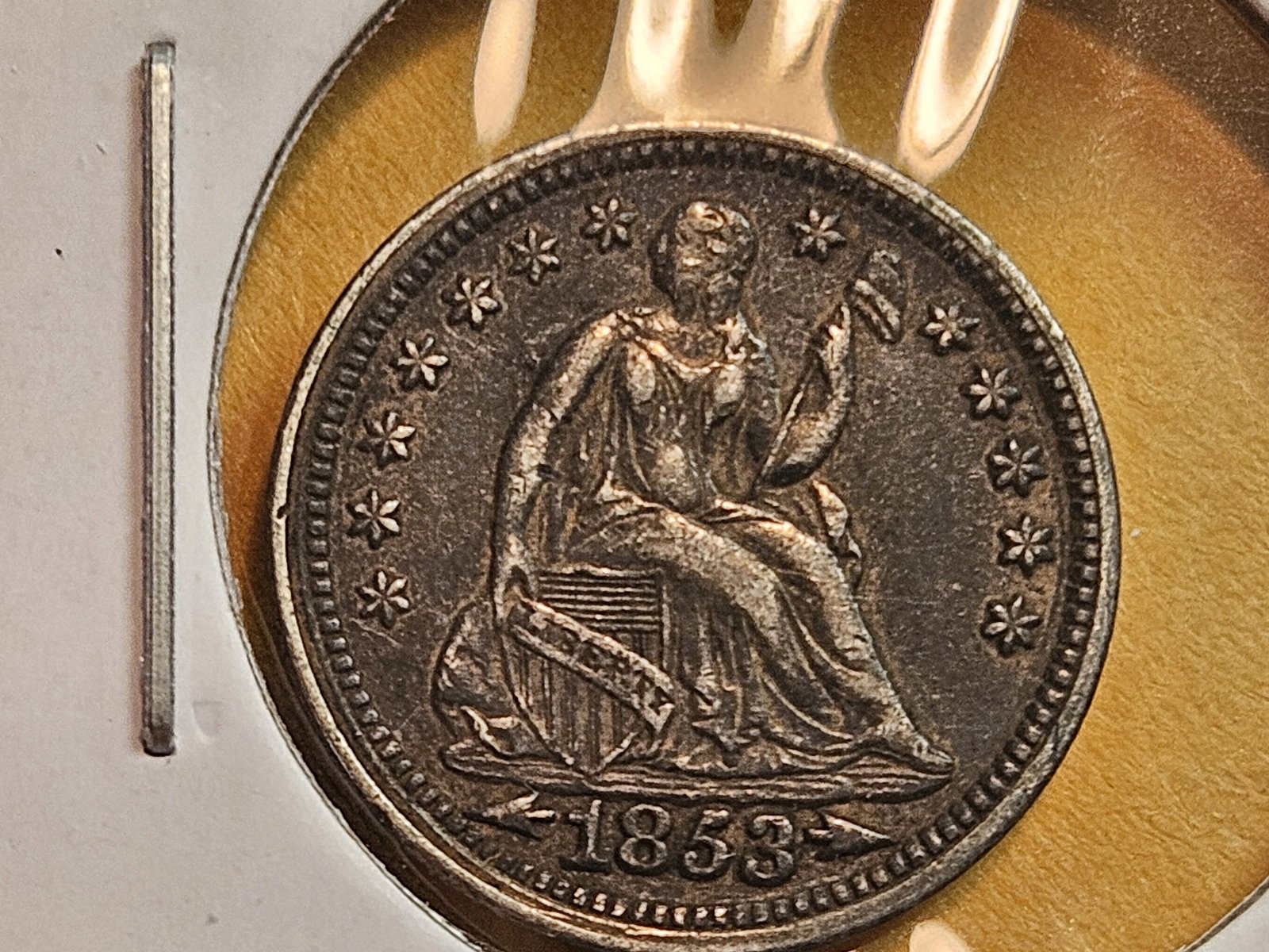 * 1853 Seated Liberty silver Half Dime in About Uncirculated plus: No obvious circulation marks. Darker patina 