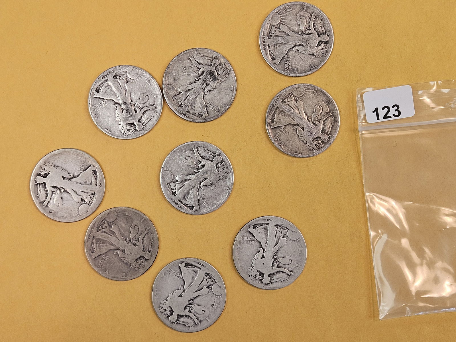 Nine mixed, silver, Walking Liberty Half-Dollars: Circulated 