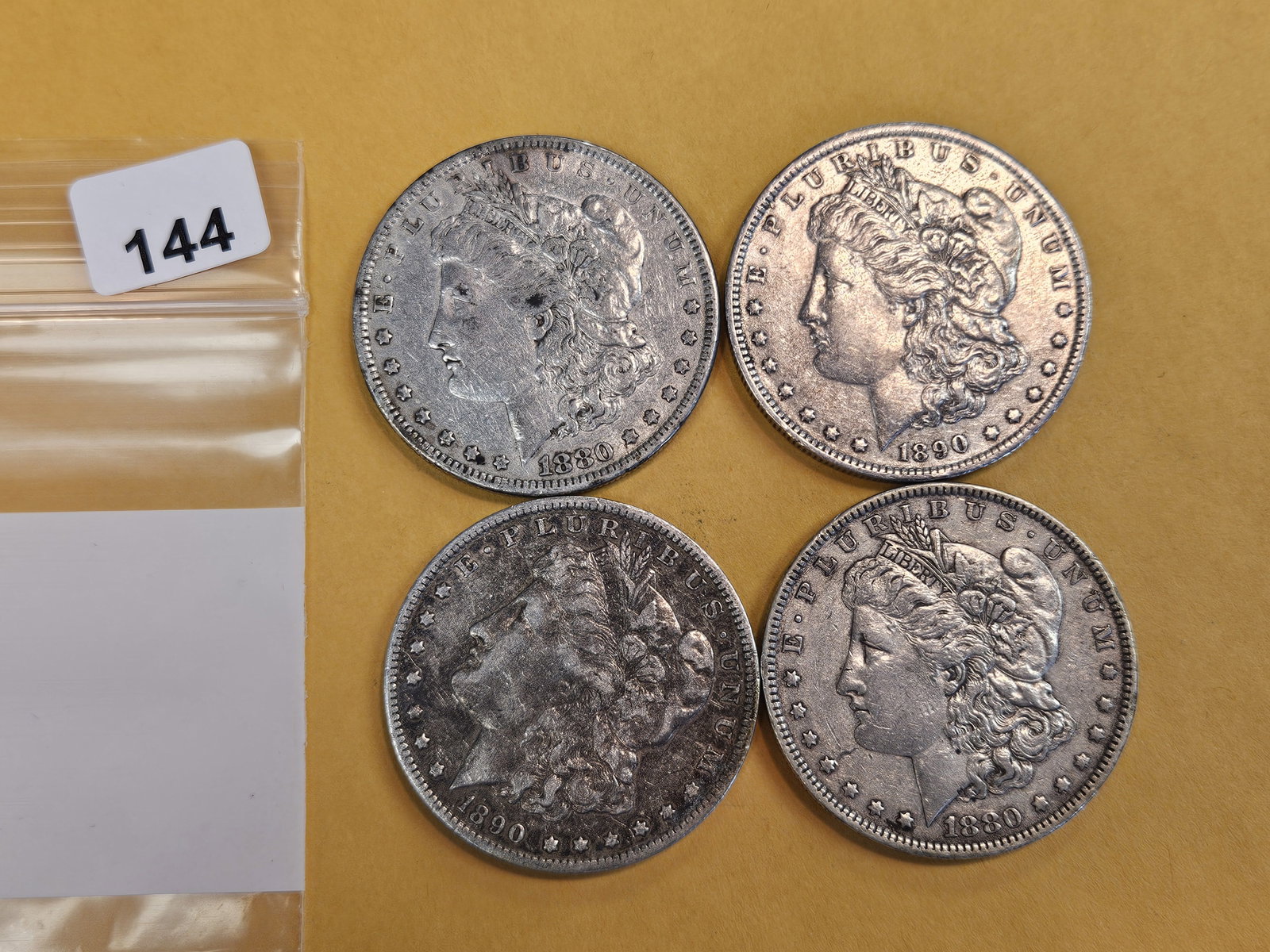 Four mixed Morgan Silver Dollars: Circulated 