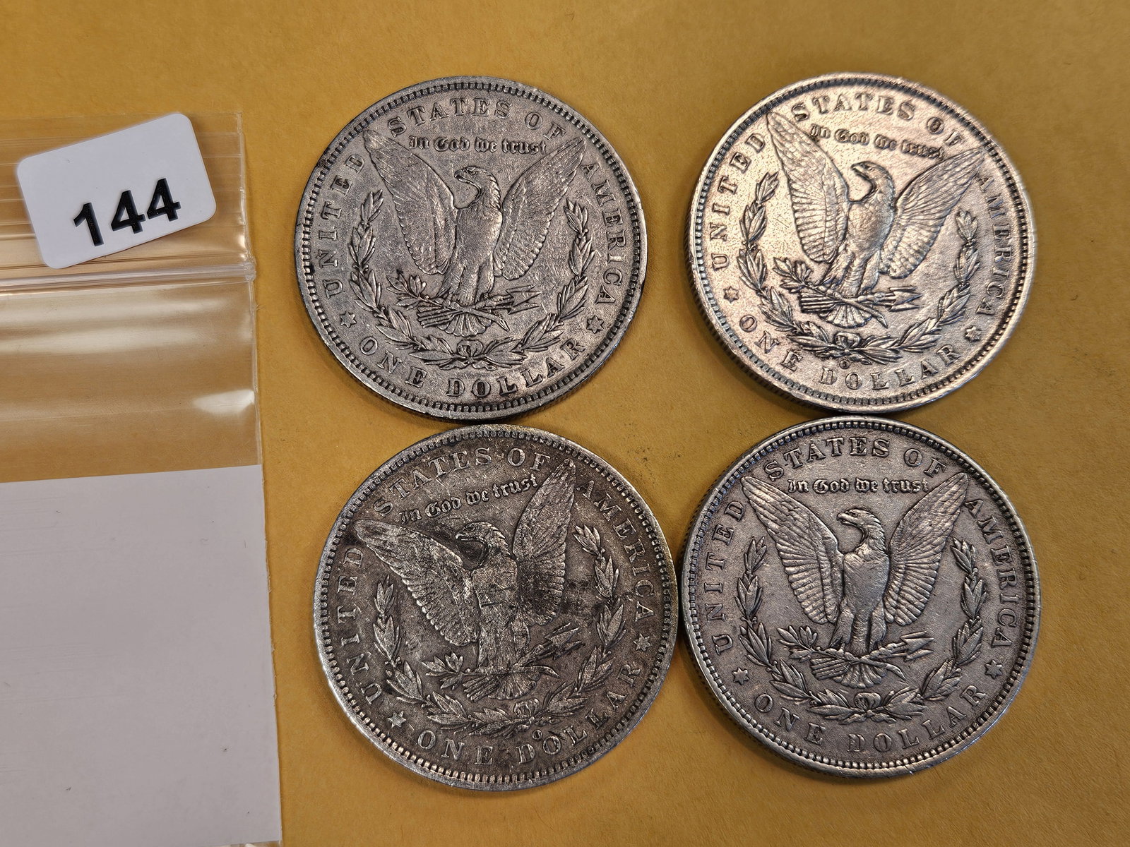 Four mixed Morgan Silver Dollars - 2