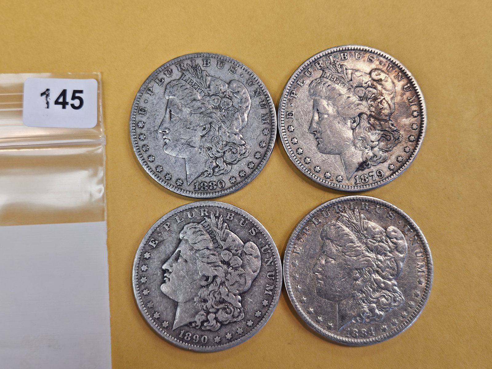 Four mixed Morgan Silver Dollars: Circulated 