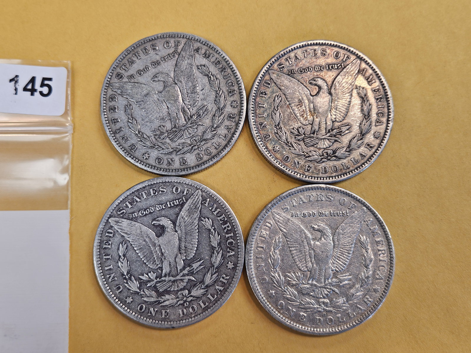 Four mixed Morgan Silver Dollars - 2