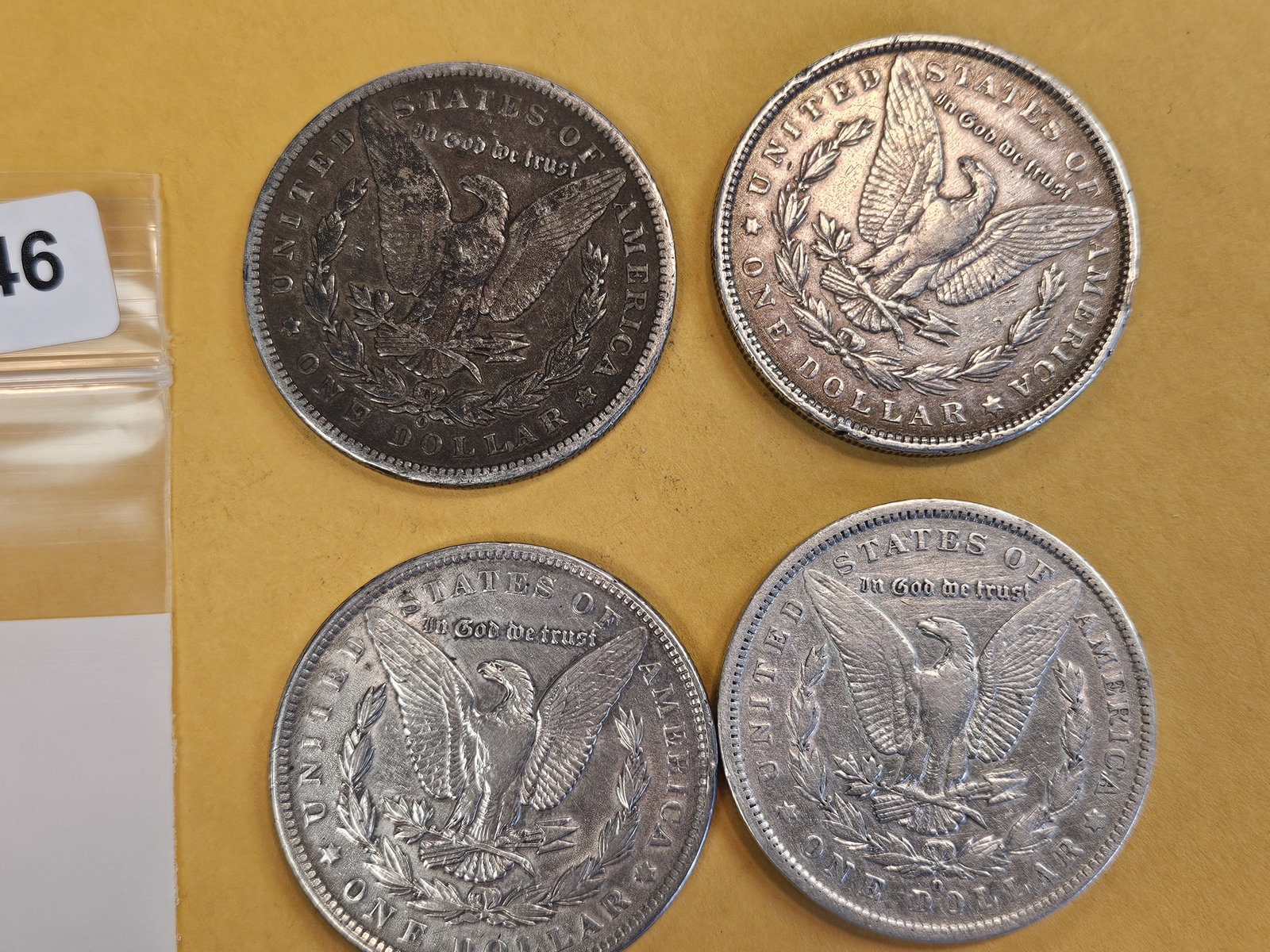 Four mixed Morgan Silver Dollars - 2