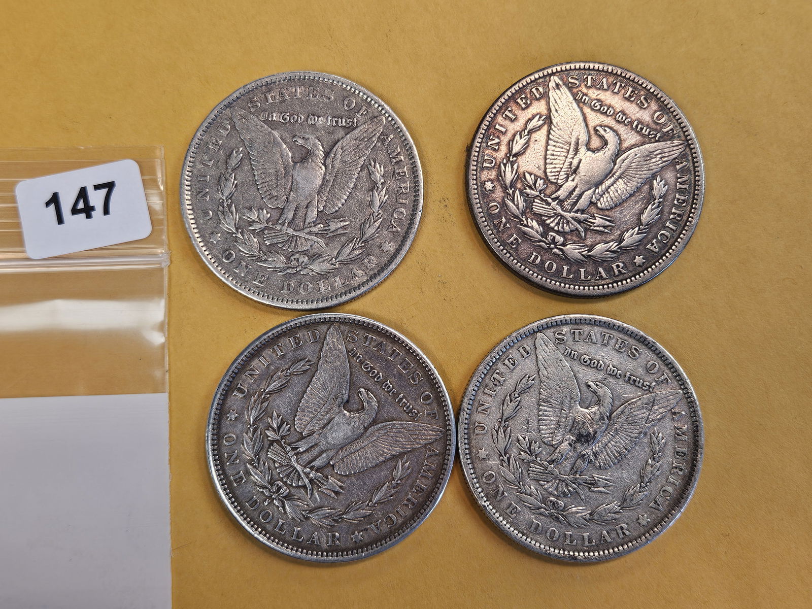 Four mixed Morgan Silver Dollars - 2