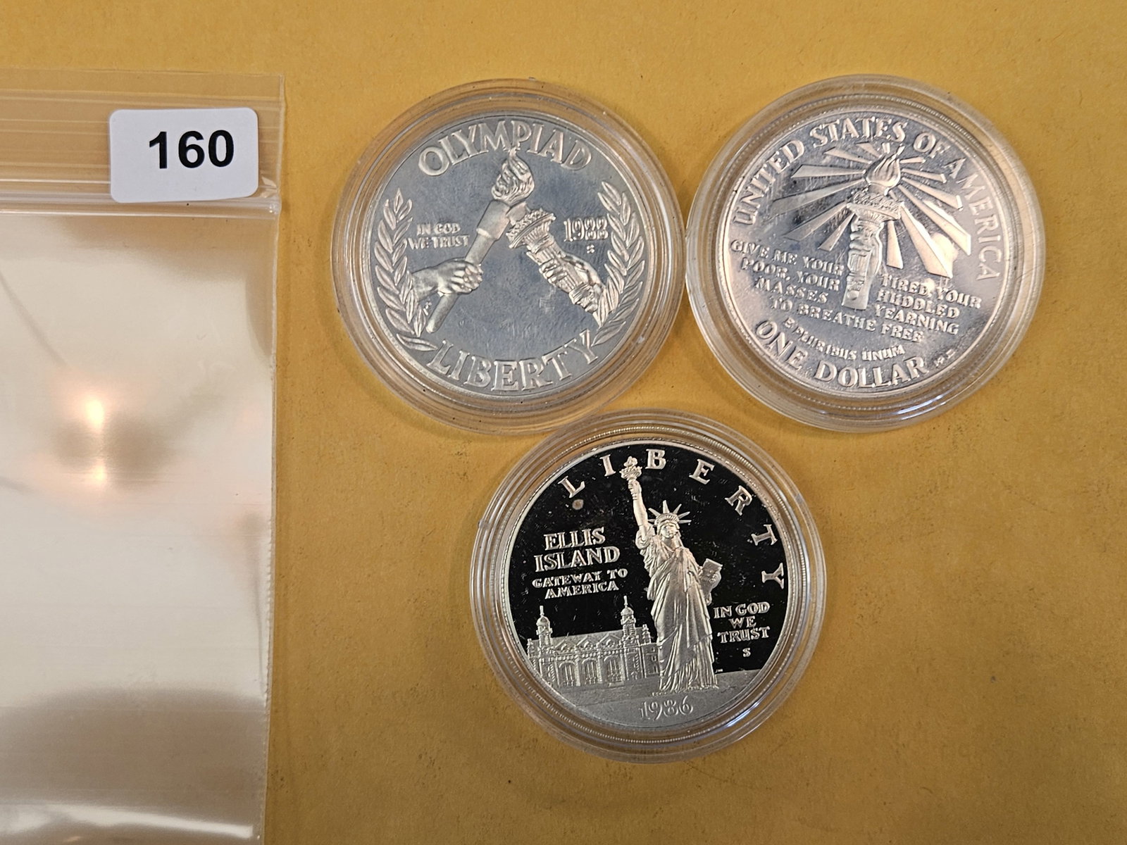 Three GEM Proof Deep Cameo Commemorative silver Dollars: In original plastic capsules 