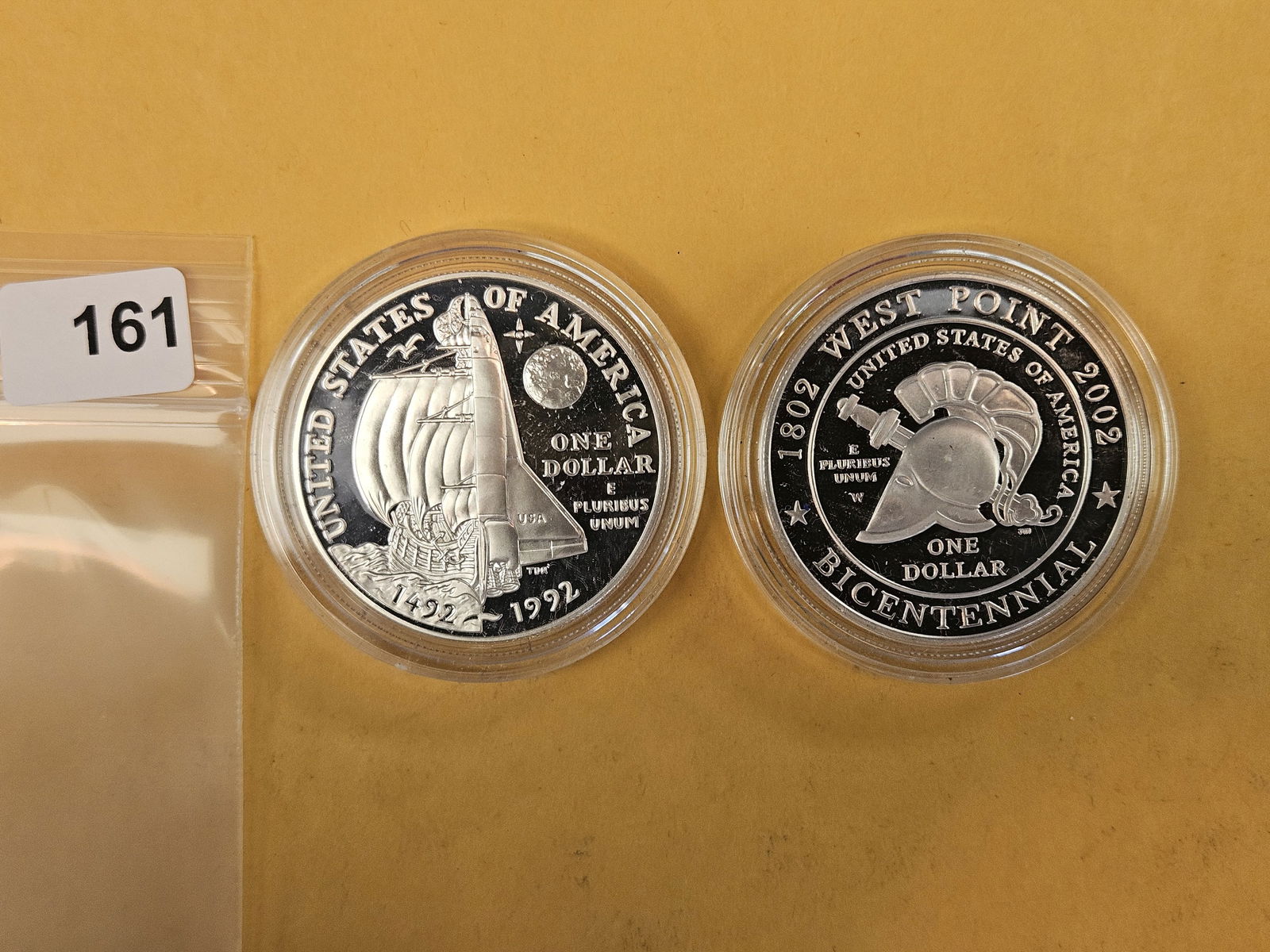 Two GEM Proof Deep Cameo Commemorative silver Dollars: In original plastic capsules