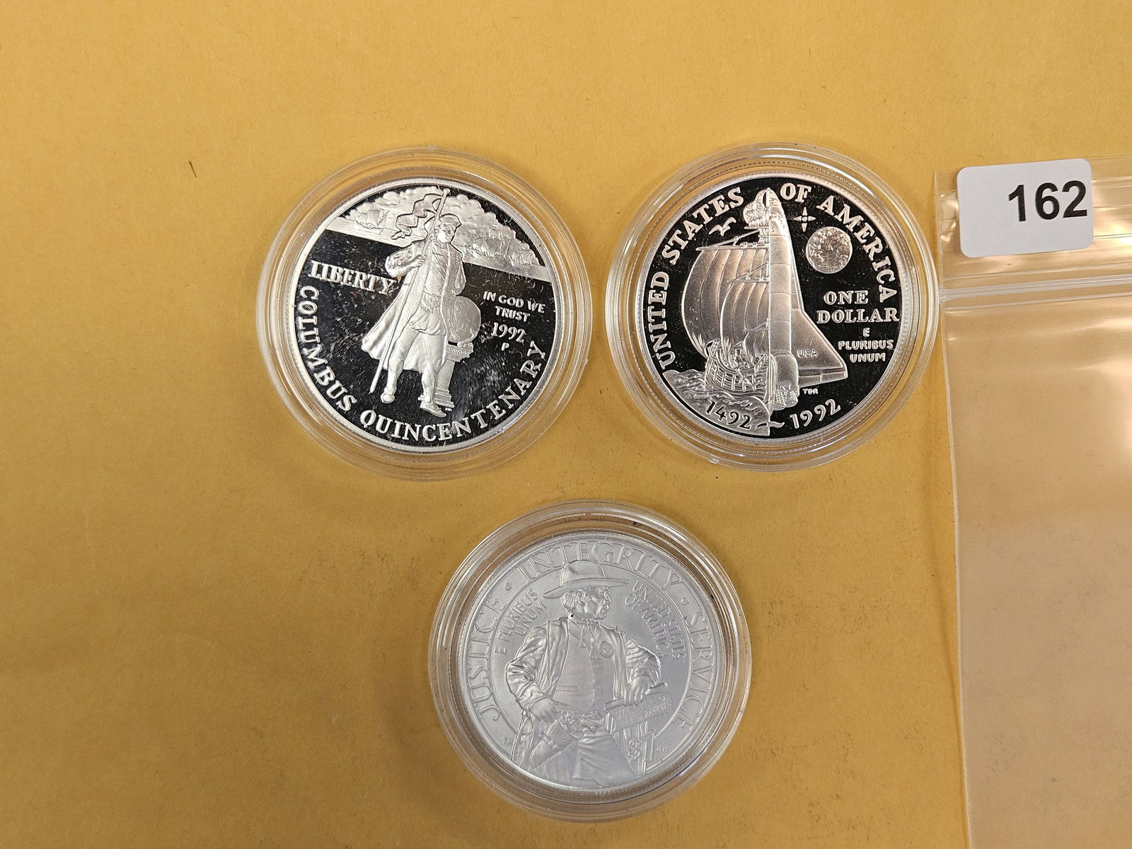 Three GEM Proof Deep Cameo and Brilliant Uncirculated Commemorative silver Dollars: In original plastic capsules 