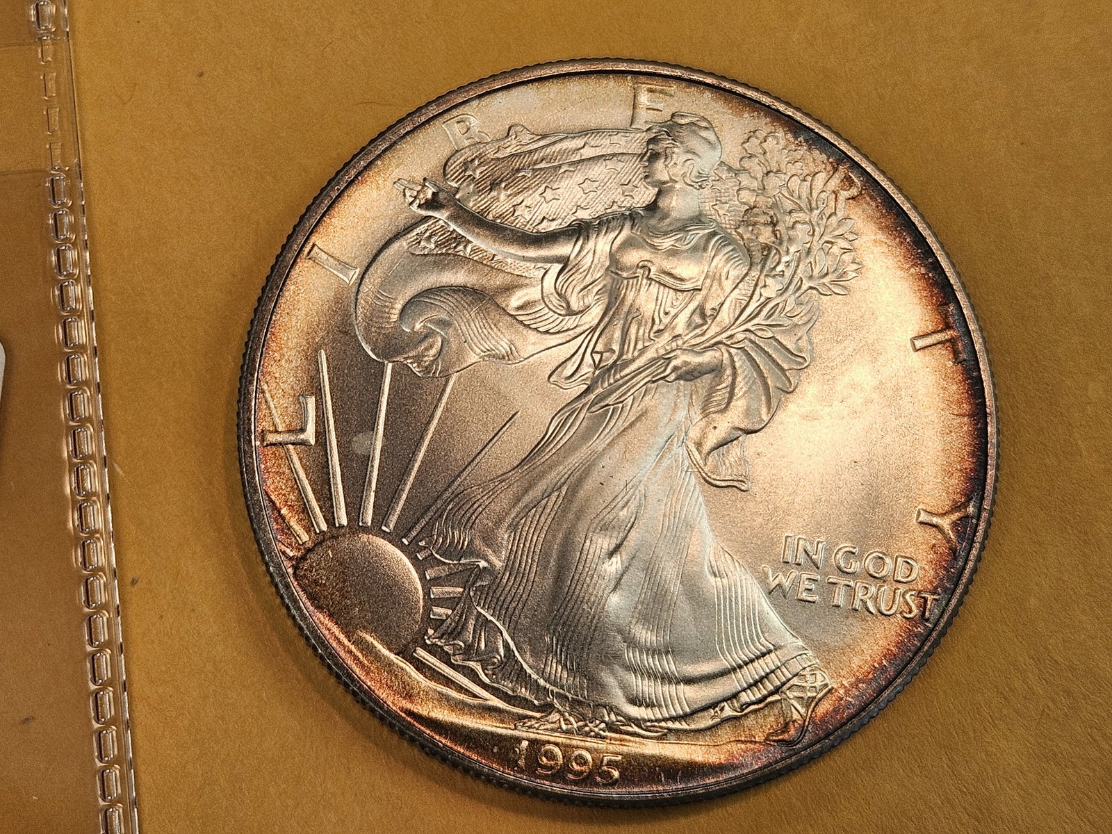 GEM Brilliant Uncirculated 1995 American Silver Eagle: Album Toning 