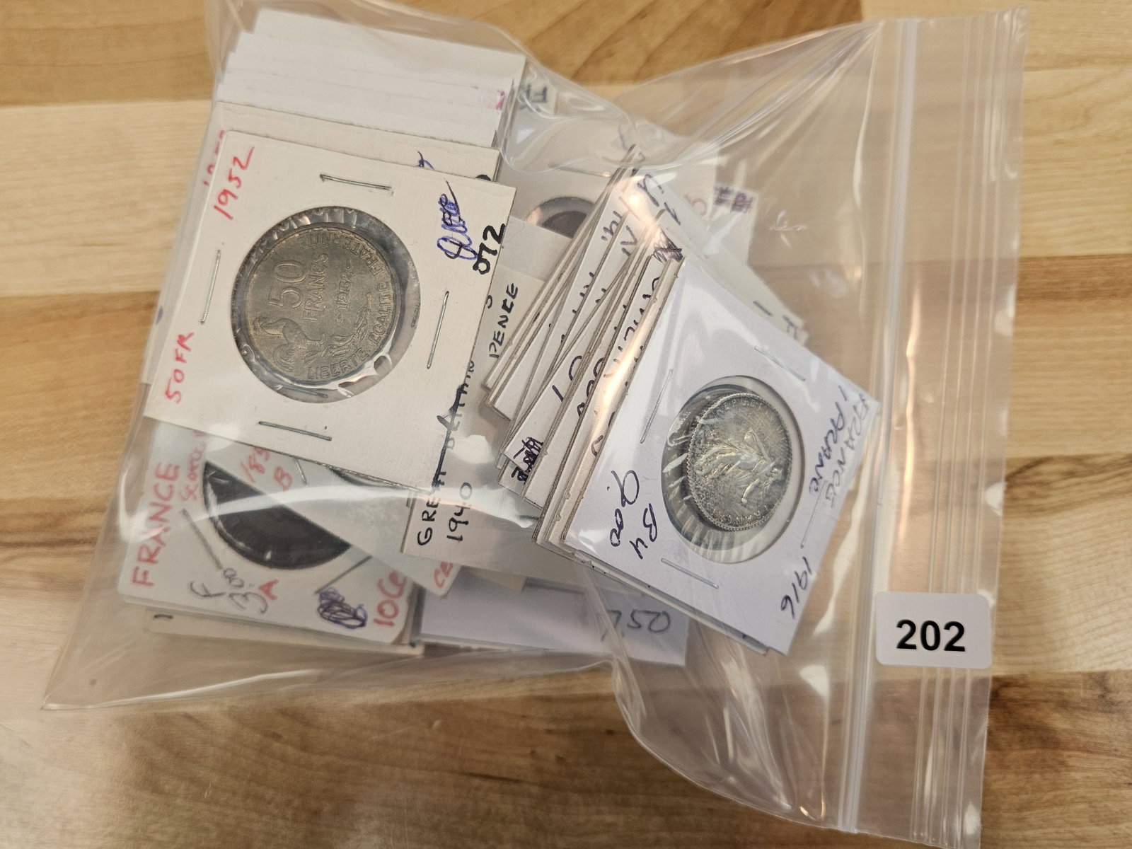 FIFTY mixed World coins: All in 2x2's. All identified with date, denomination, and KM number. Only or 2 silvers 