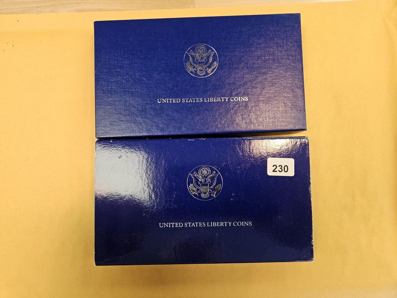 Two GEM Proof US Liberty 2-coin sets: Both with Silver dollars and clad halves 