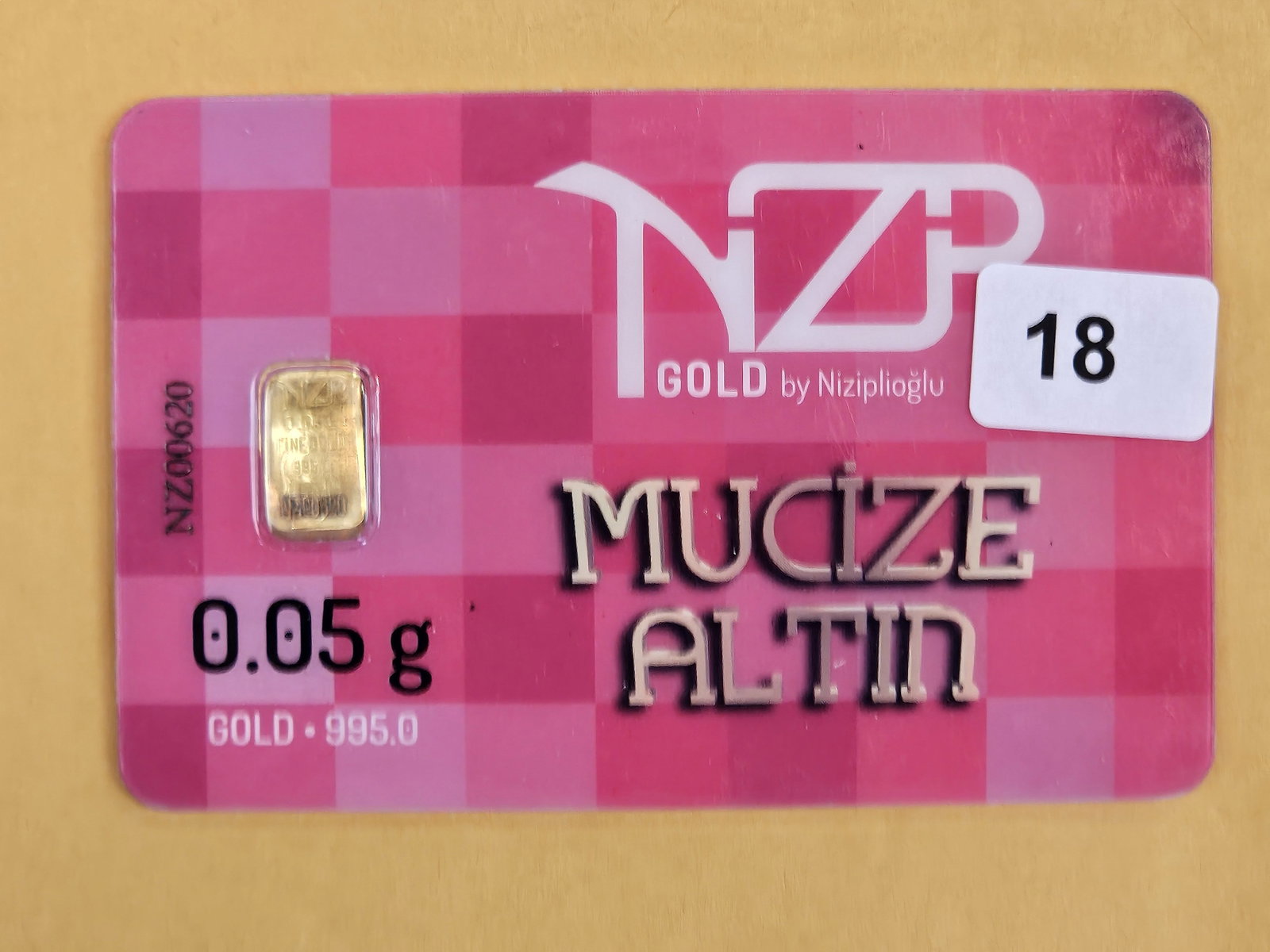GOLD! NZP .995 Gold Bar: In original assay certification holder. Weighs .05 grams