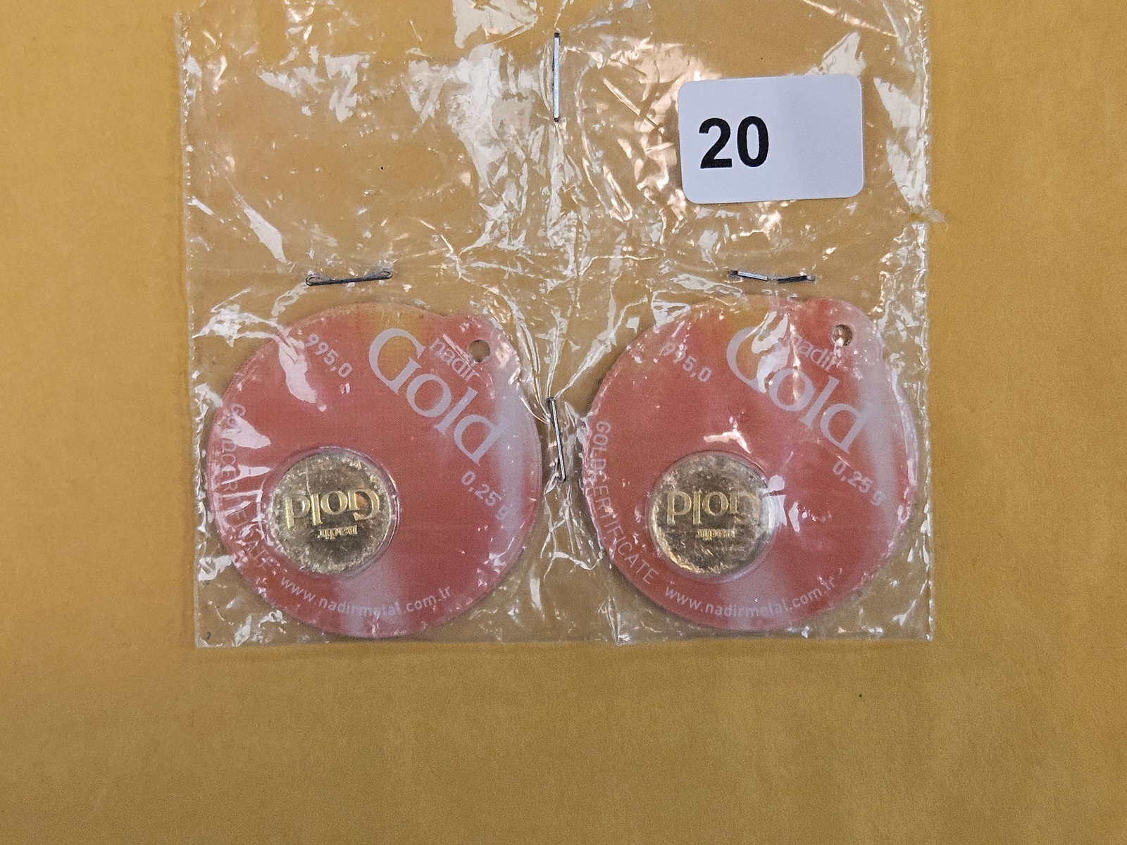 GOLD! Two NADIR .995 Gold rounds: In original assay certification holder. Both weighs .25 grams each 