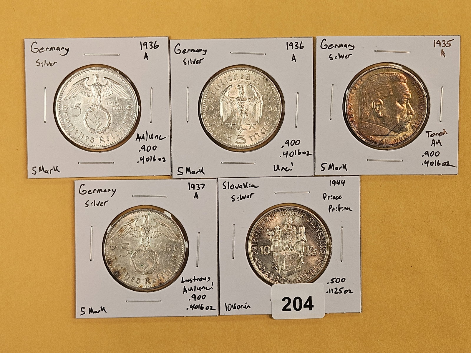 Five nice, mixed, silver, World Coins: All identified by date, denomination and KM number. All in 2x2's 