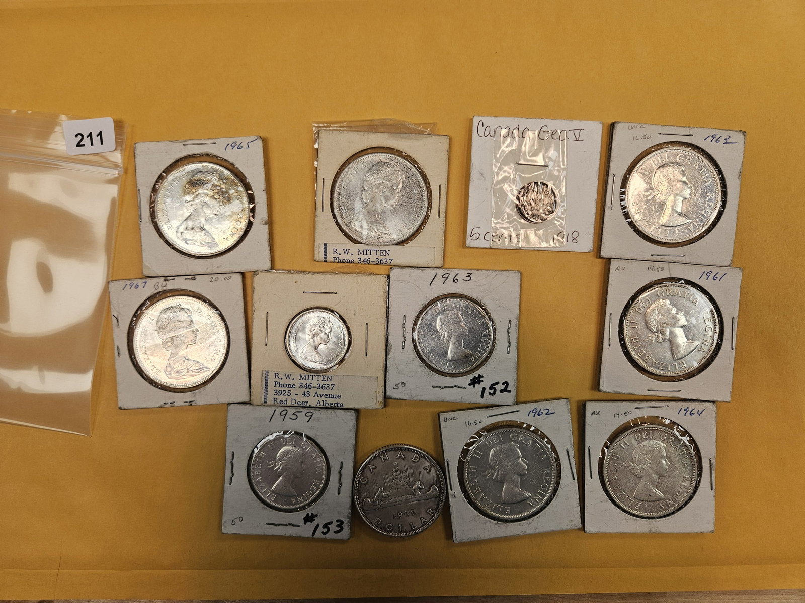 Twelve, mostly-larger, Canadian silver coins: Mixed...mostly dollars