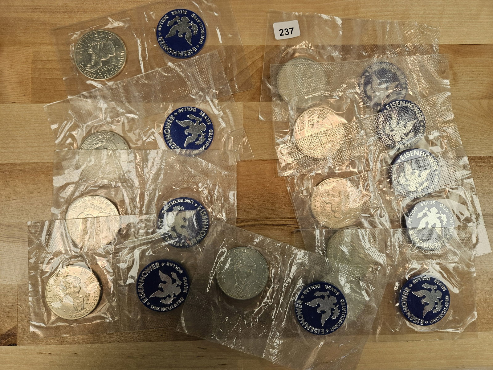 TEN GEM brilliant Uncirculated silver Eisenhower Dollars: All in blister packs. No outer envelopes or COAs