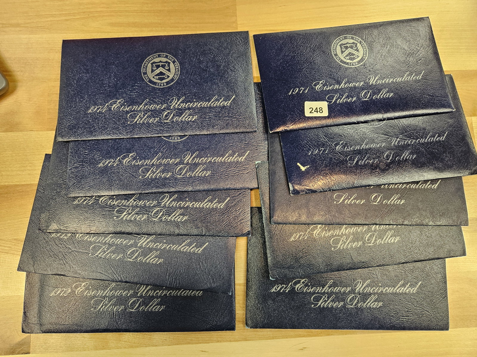 TEN mixed, SILVER, GEM Brilliant Uncirculated Eisenhower Dollars: SILVER Blue IKES! All in original GSA Flat packs. All in OGP