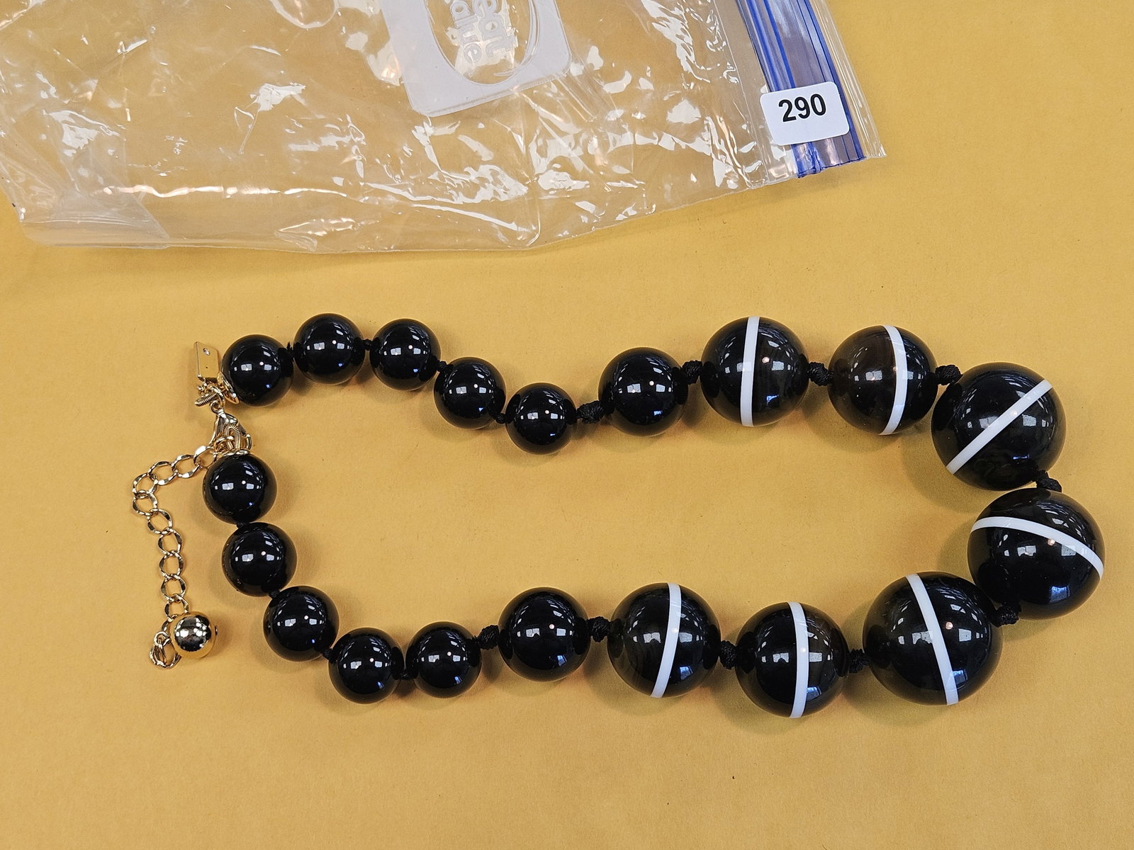 Jewelry: yeah….necklace of some type. Not even sure what to call this. Says Kate Spade New York on it. Not gold 