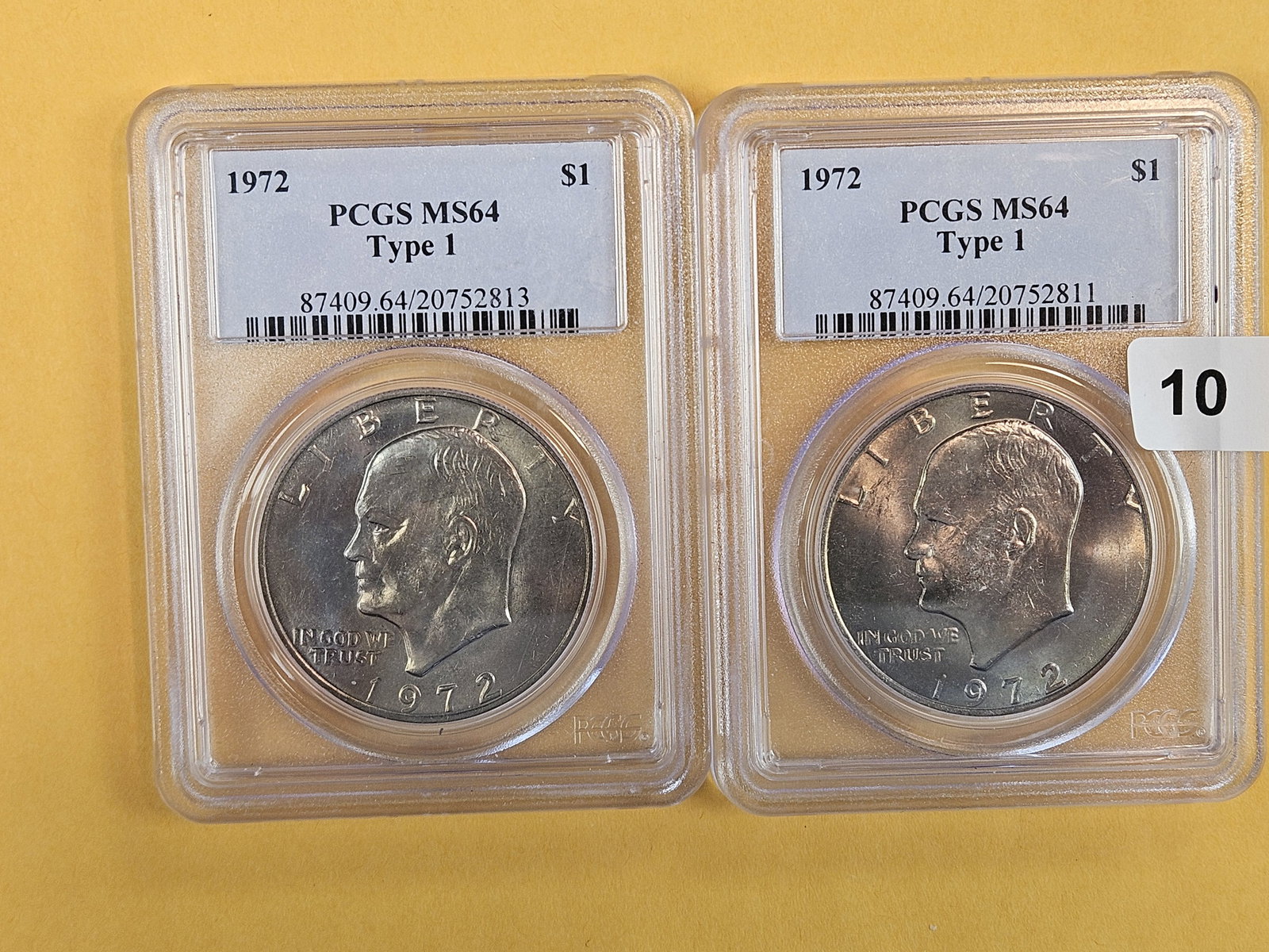 Two PCGS 1972 Type 1 Eisenhower Dollars in Mint State 64: Both near mint 