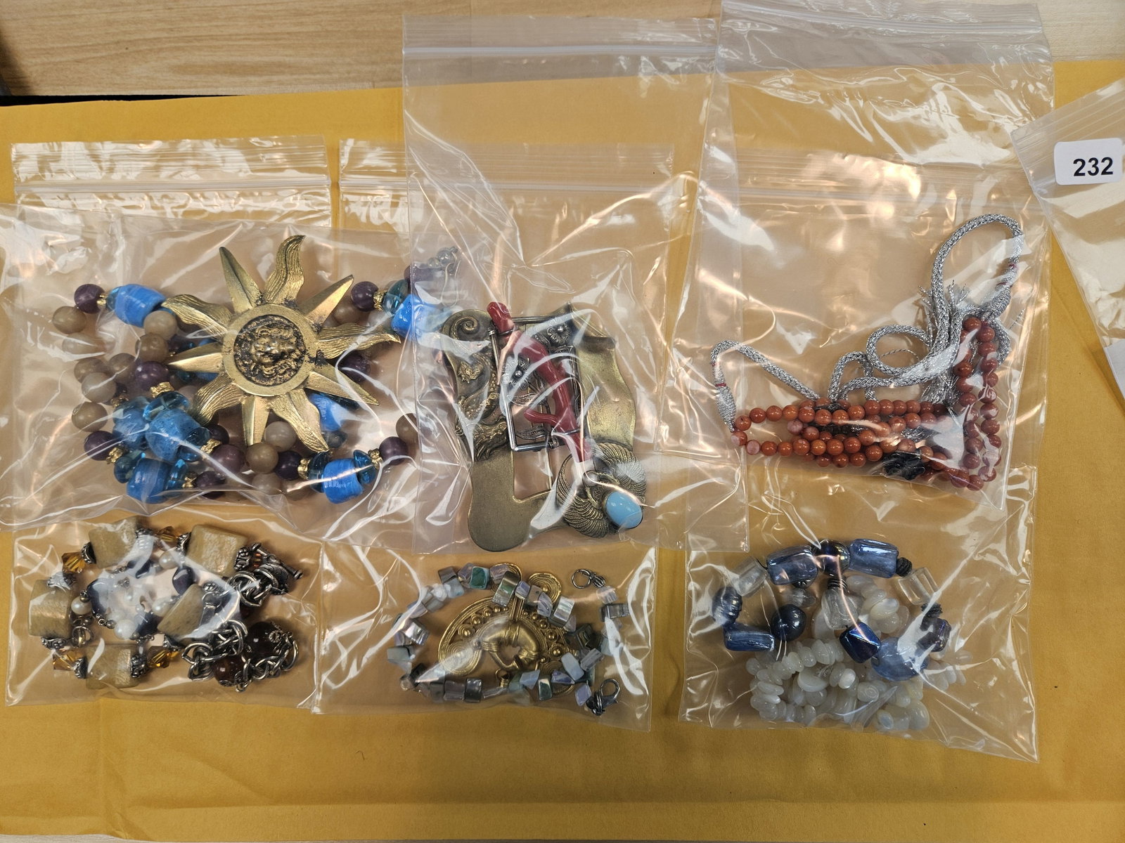 JEWELRY: From dealer. He sorted out all his nicer costume jewelry. He said a lot was vintage, but it's not really my cup of bananas 