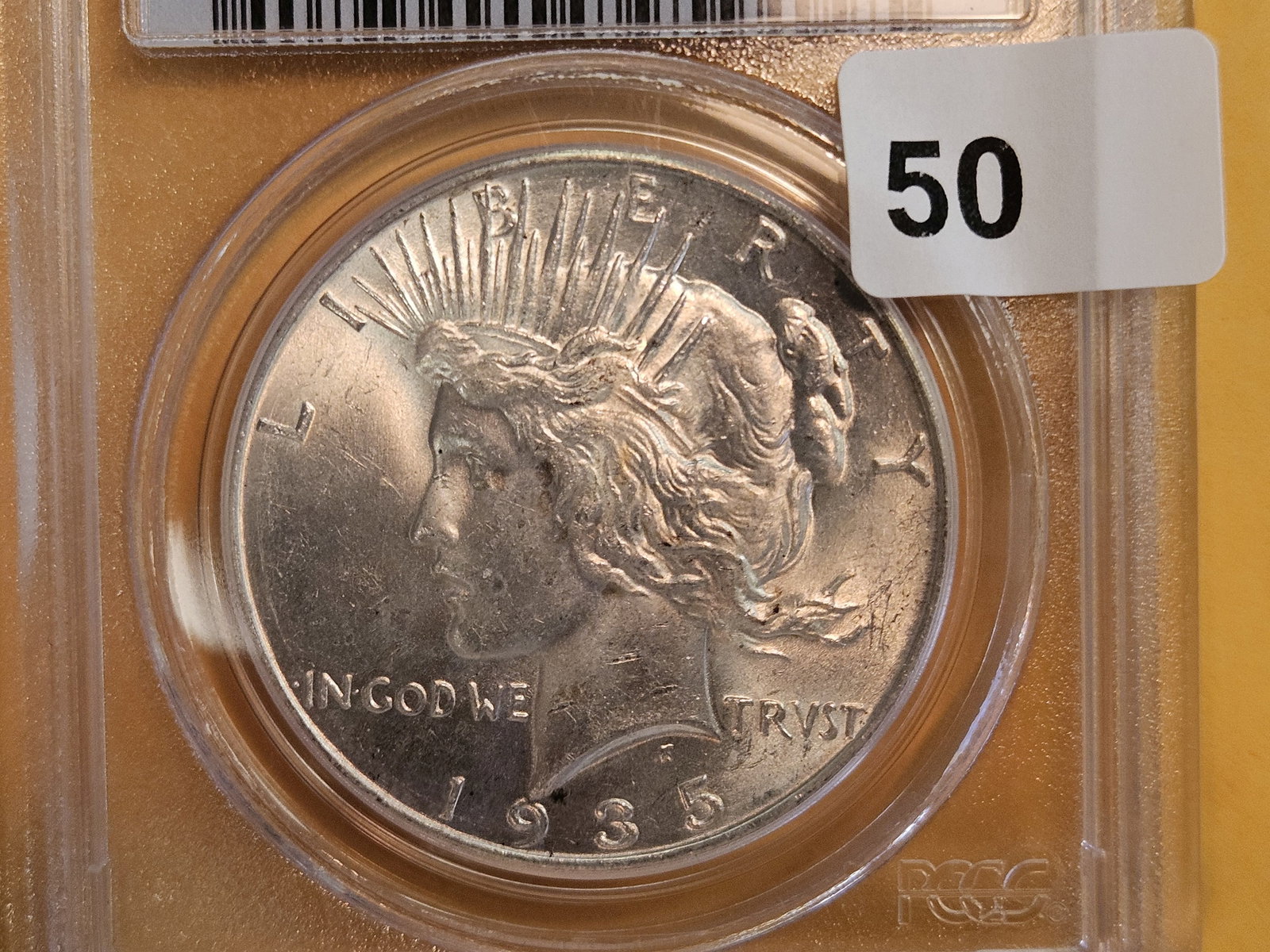 Better Grade! PCGS 1935 Peace silver Dollar in Mint State 63: Great cartwheel! 