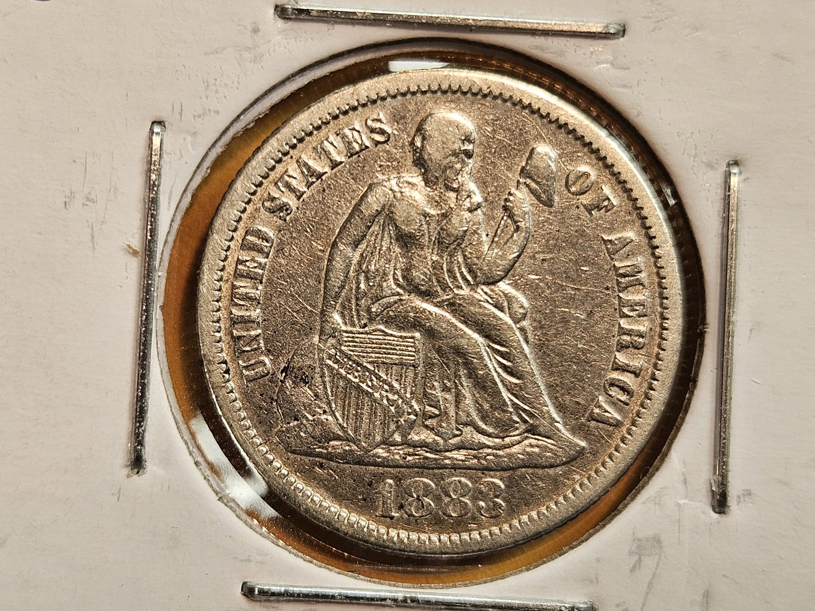 1883 Seated Liberty silver Dime in Extra Fine: Might have been cleaned a long time ago 