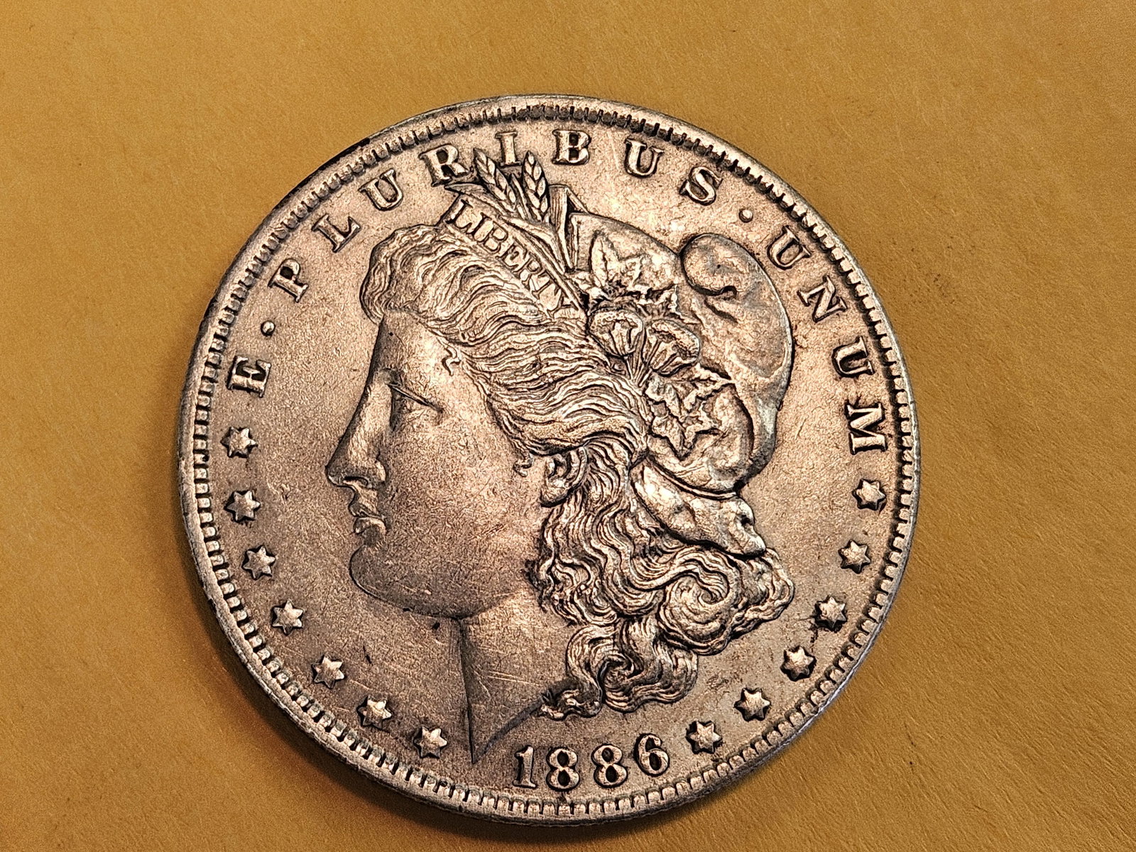 Better 1886-O Morgan Dollar in About Uncirculated - details: Lil better higher grade coin 