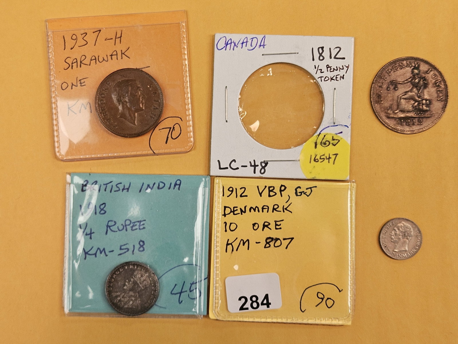 Four better date and-or grade world coins (1 of 9)