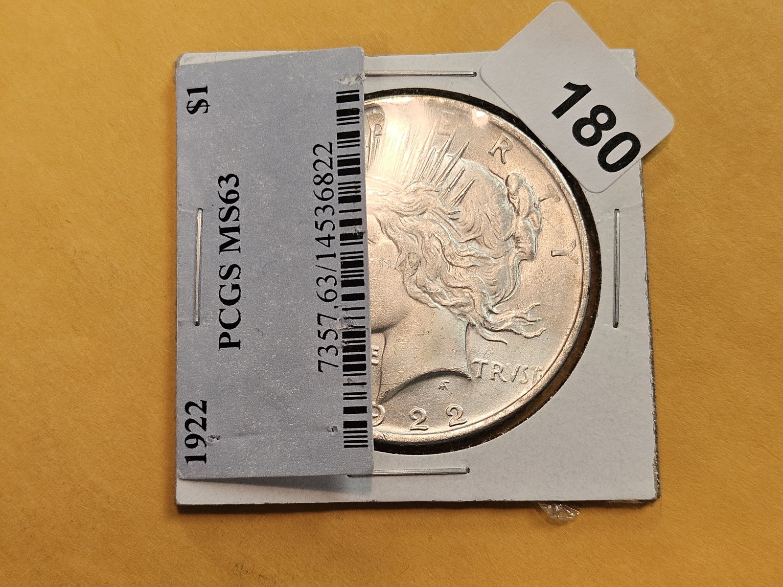 Choice Brilliant Uncirculated Plus 1922 Peace Silver Dollar: This beauty was originally housed in a PCGS holder and graded MS-63. The collector took a lot of his coins and took them out of the slabs and put them in Dansco albums. 