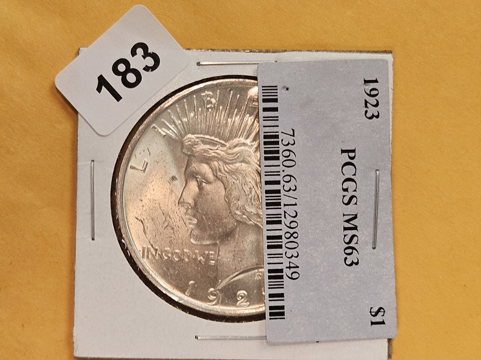 Choice Brilliant Uncirculated Plus 1923 Peace Silver Dollar: This beauty was originally housed in a PCGS holder and graded MS-63. The collector took a lot of his coins and took them out of the slabs and put them in Dansco albums.
