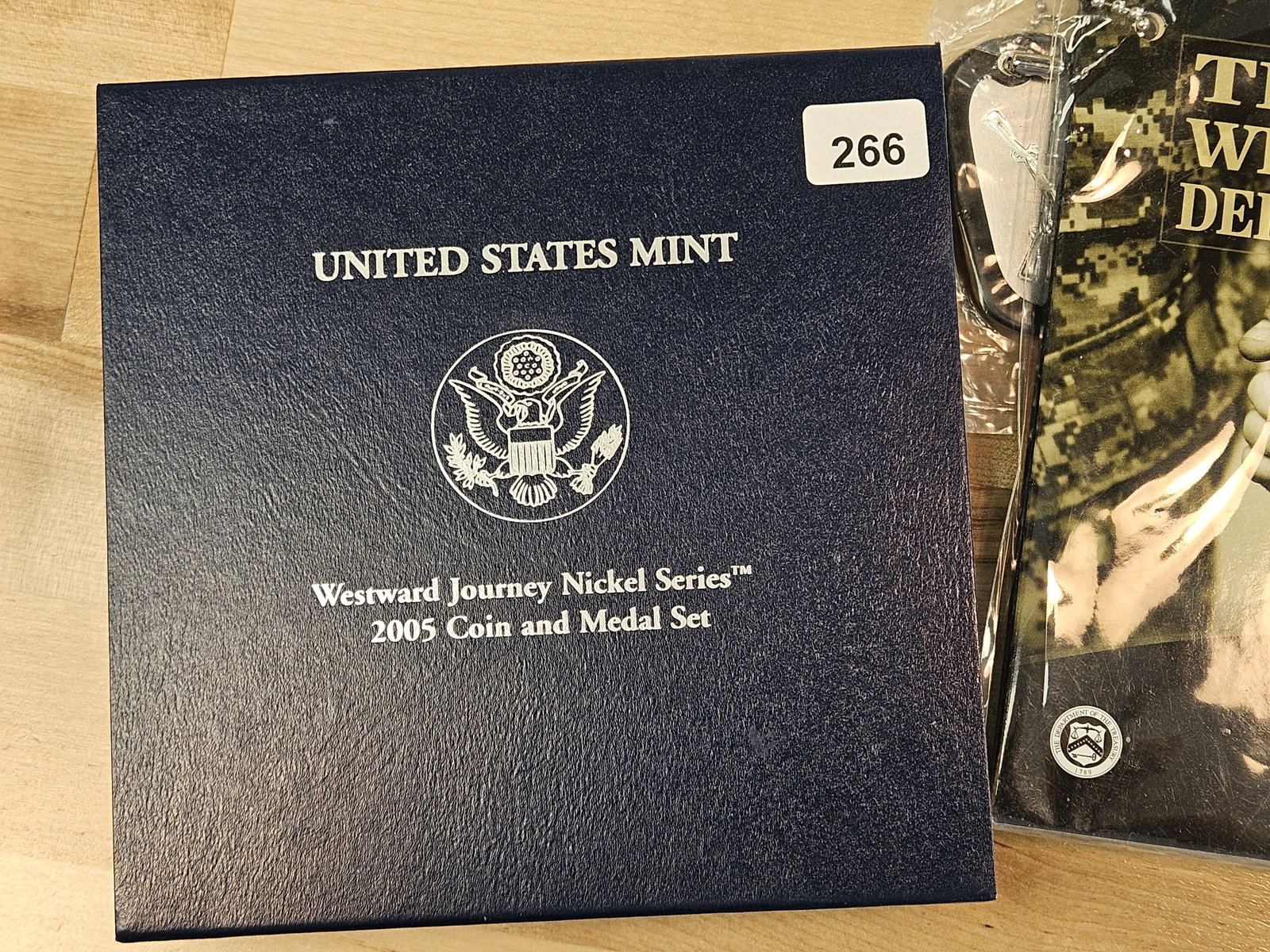 Three US Mint Sets: One has the Proof Silver Dollar in it