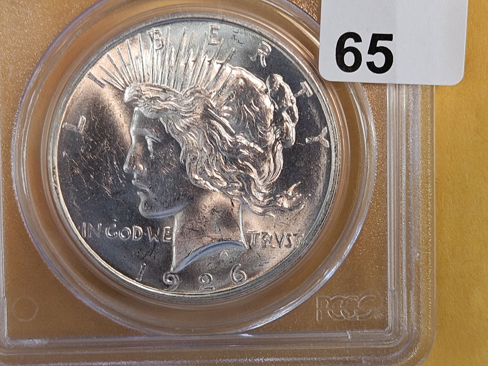 Better PCGS 1926-D Peace silver Dollar in Mint State 62: Great contrast. Looks better than a 62 