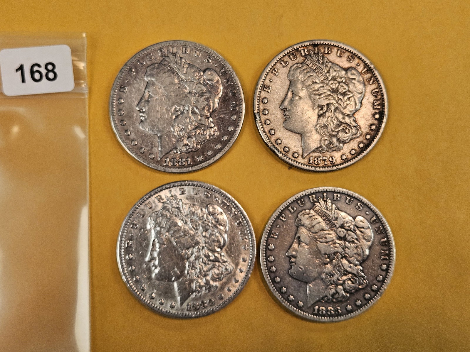 Four mixed Morgan Silver Dollars: Circulated 