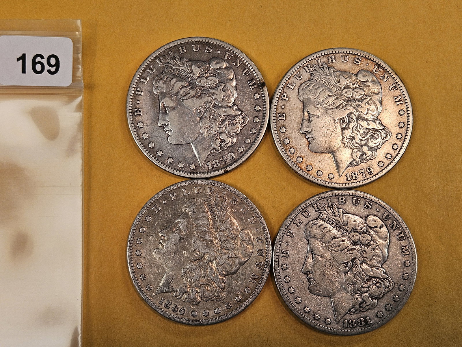 Four mixed Morgan Silver Dollars (1 of 2)