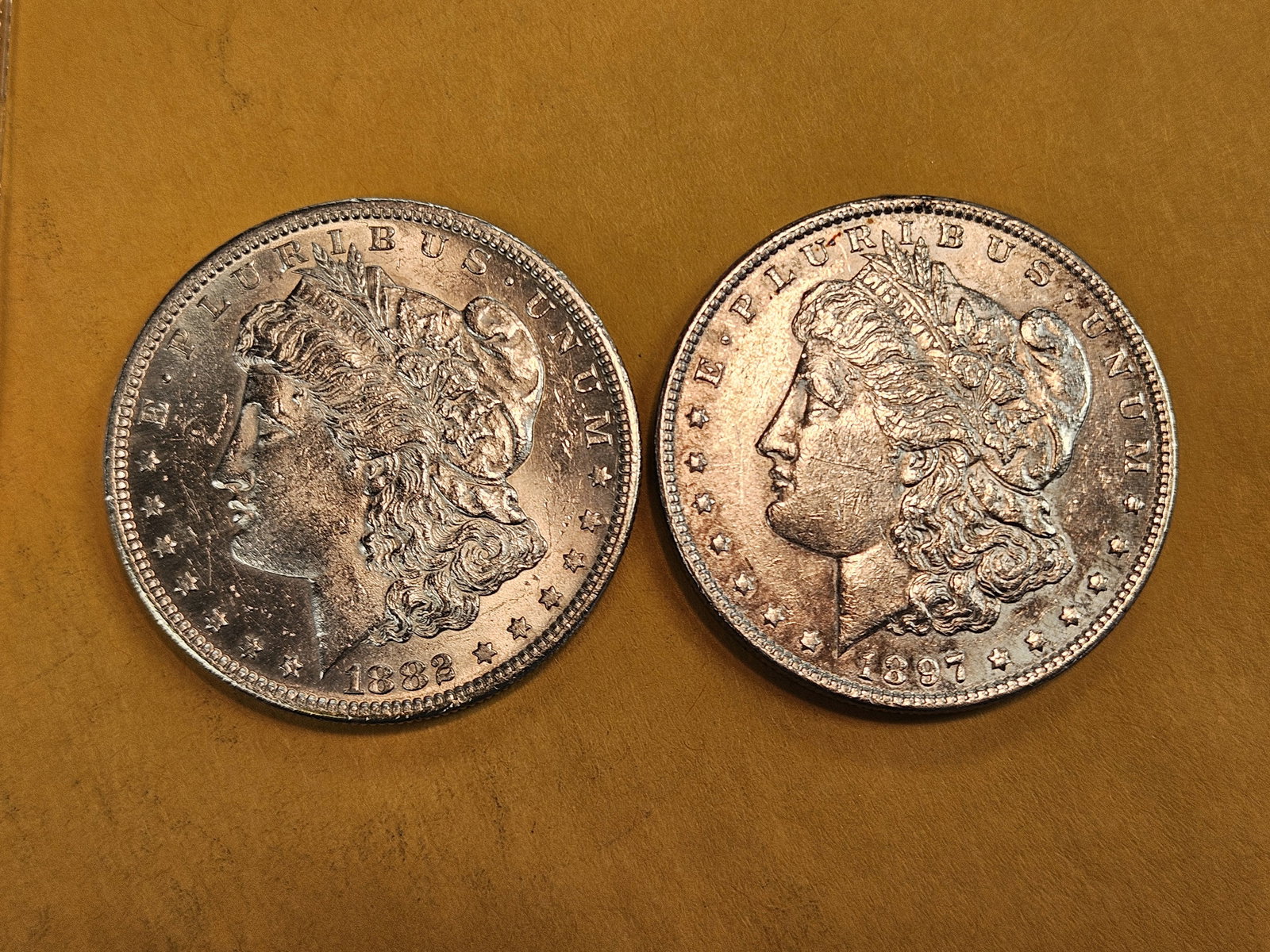 Two Brilliant About Uncirculated Plus Morgan silver Dollars (1 of 3)