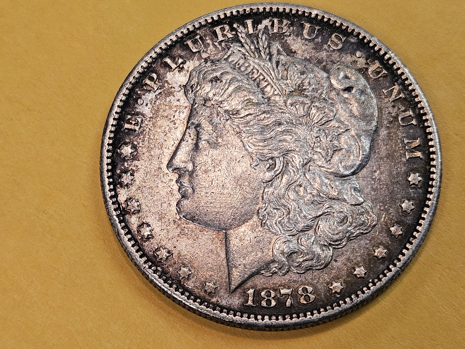 1878-S Morgan silver Dollar in About Uncirculated plus: Nice patina 