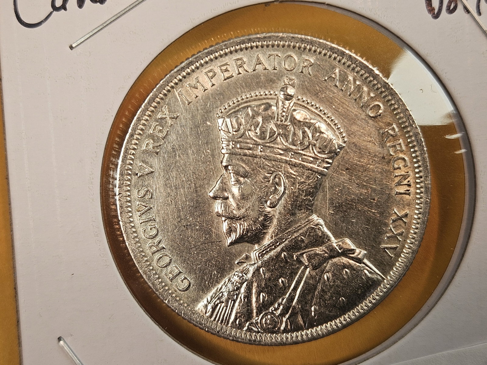 Bright About Uncirculated plus 1935 Canada silver Dollar: Might have been cleaned a long time ago