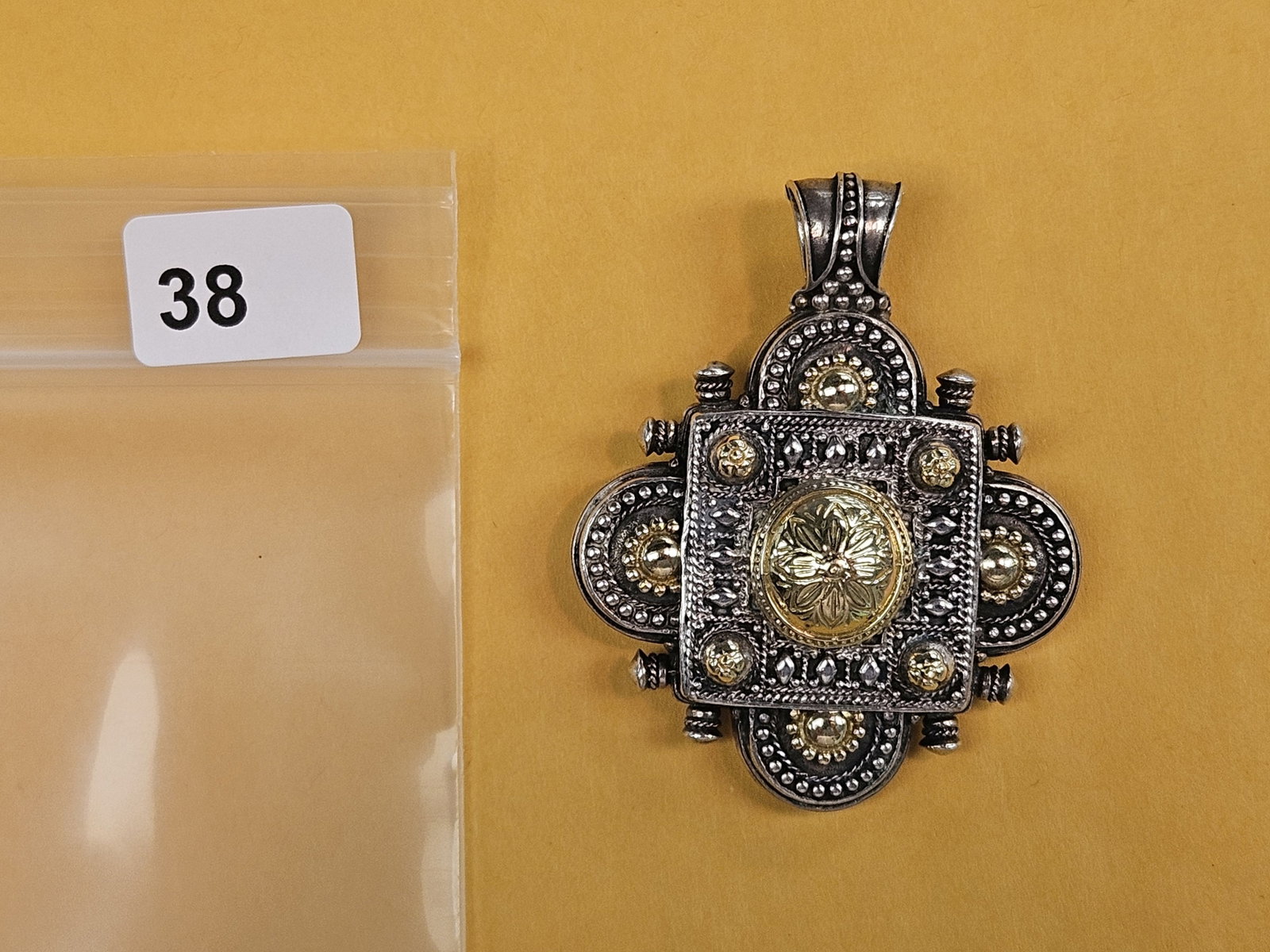 GOLD JEWELRY! Large 18 karat gold and sterling silver pendant: Total weight is 33.4 grams