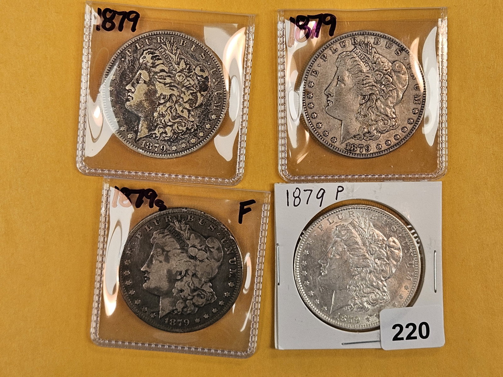 Four Morgan Silver Dollars (1 of 2)