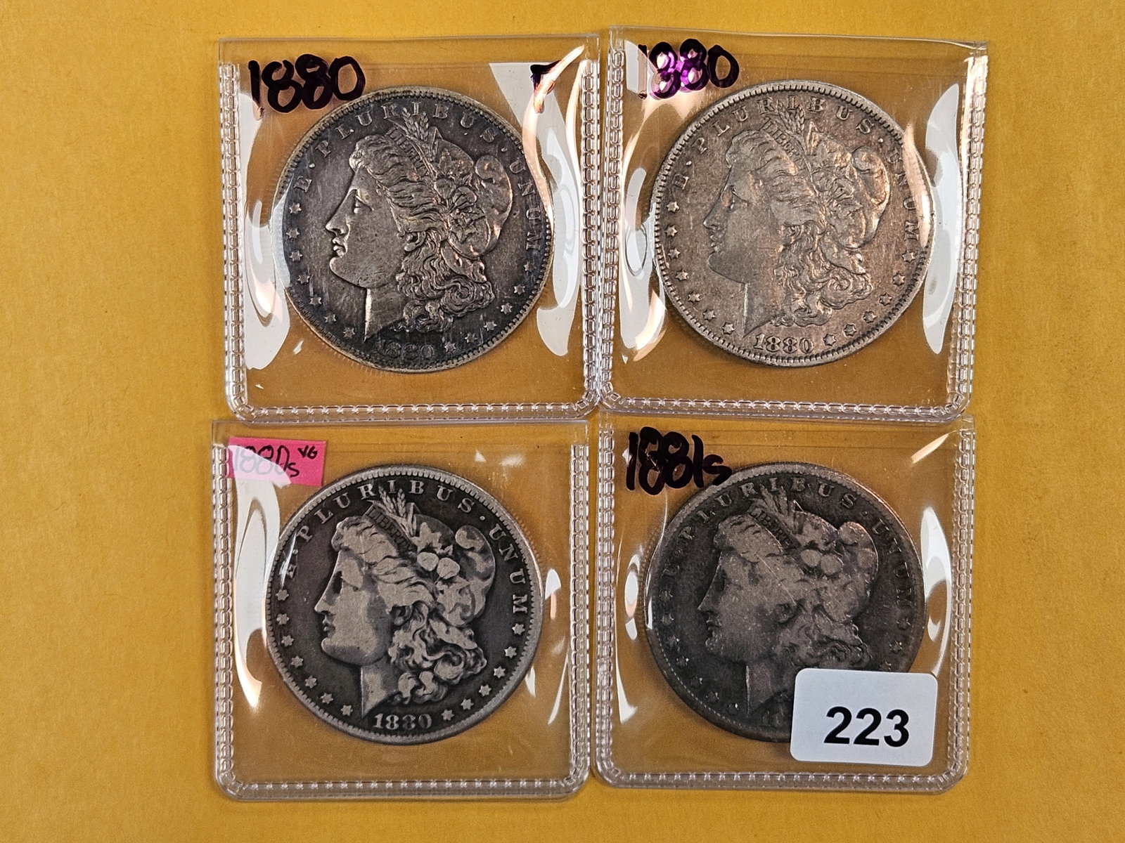Four Morgan Silver Dollars (1 of 2)