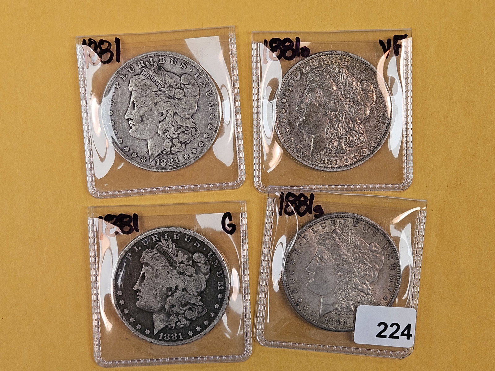 Four Morgan Silver Dollars (1 of 2)