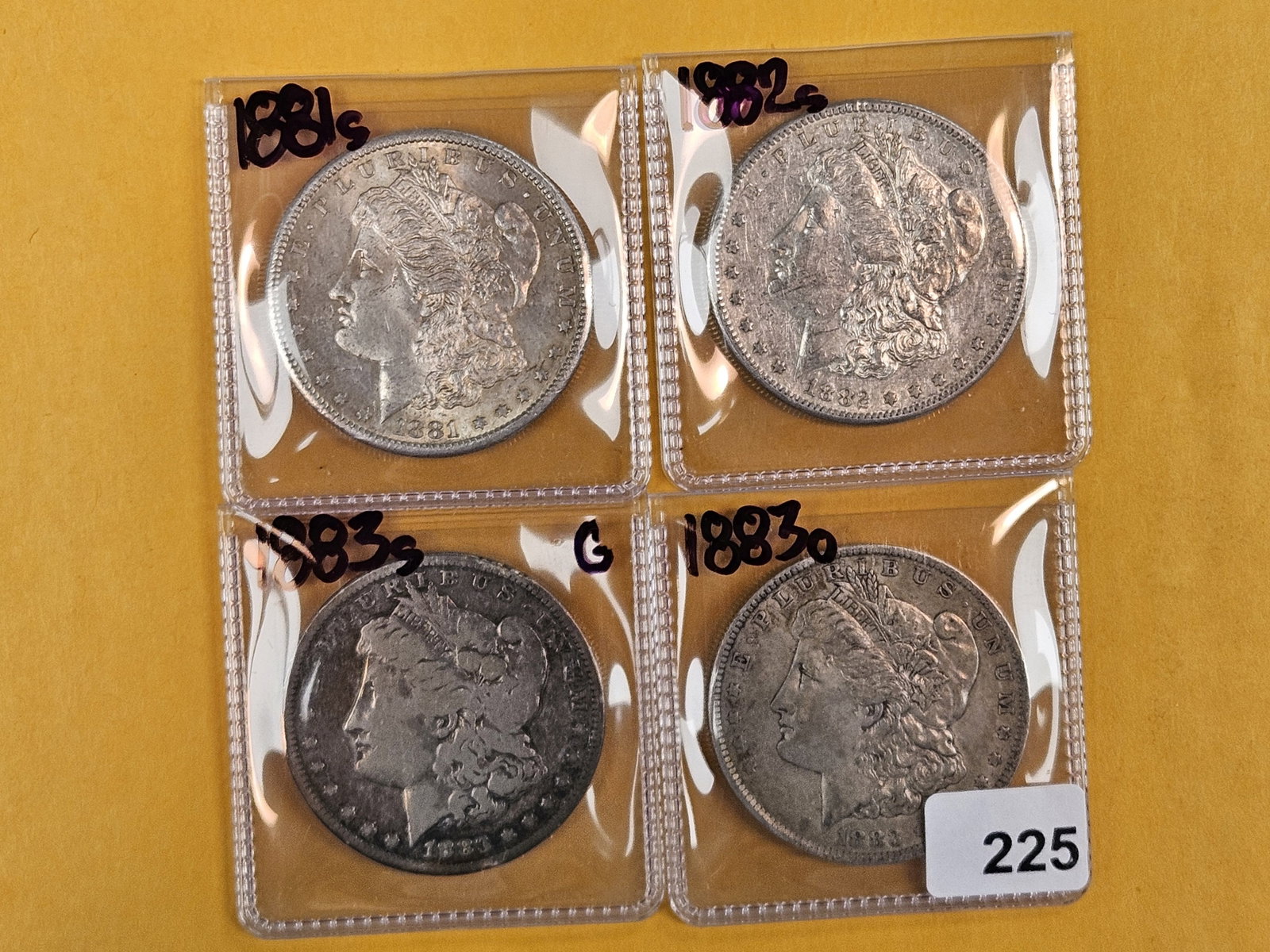 Four Morgan Silver Dollars (1 of 2)