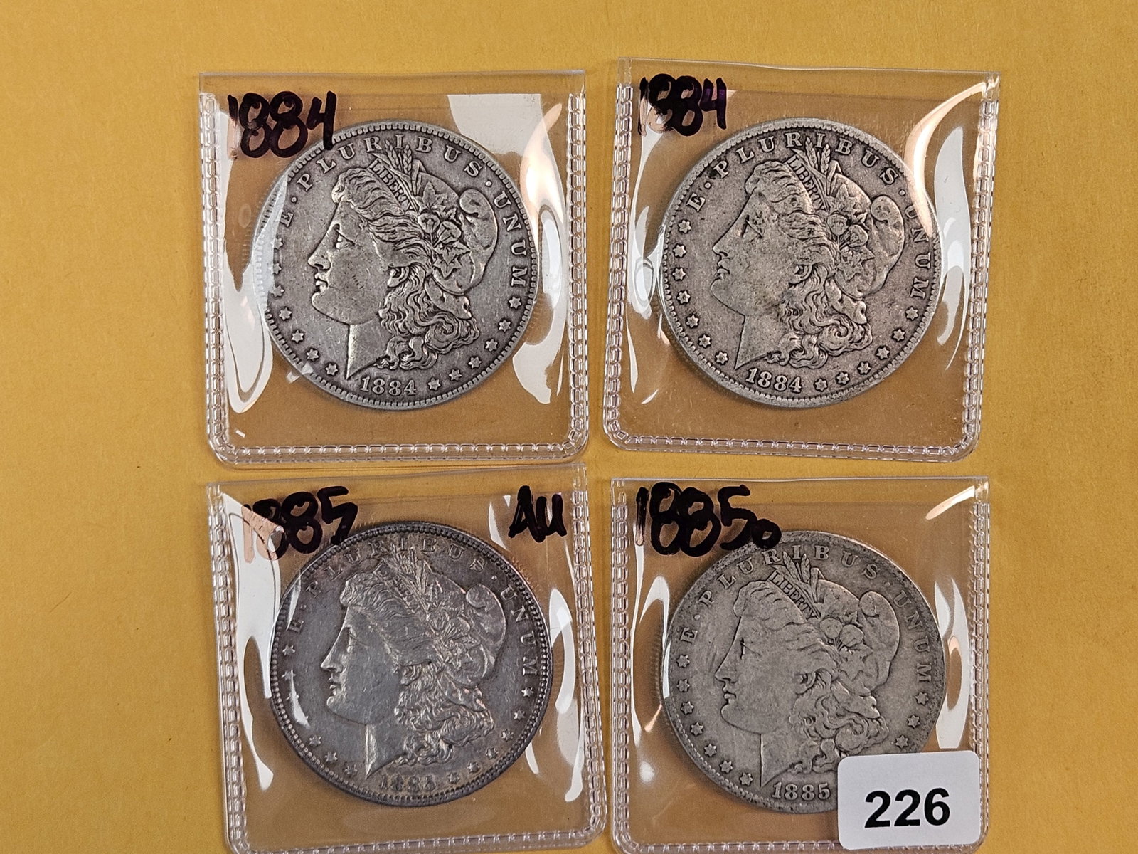Four Morgan Silver Dollars (1 of 2)