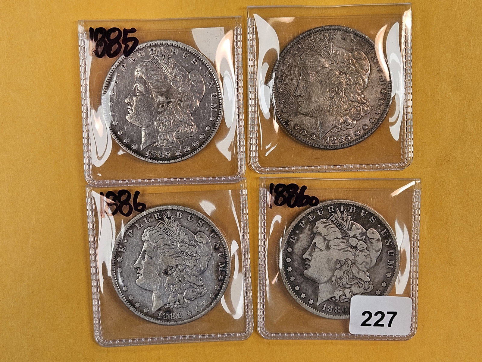 Four Morgan Silver Dollars (1 of 2)